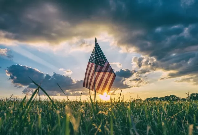 flag of USA on grass field - American Holidays (Memorial Day)